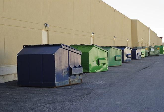 a row of industrial dumpsters for construction waste in Broomall